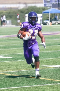 Running past: Junior running-back Foorever Campbell runs back into play this season after suffering an ACL tear in 2014.   Photo Credit--Andy Horan Sports Information Photographer