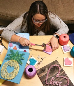 The hustle: Senior Victoria Lahney said there was “an overwhelming amount of interest” in her string art designs.  Photo by Inga Parkel - Photojournalist