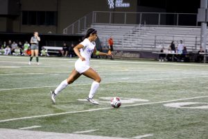 Sophomore defender Trinity Martinez takes advantage of open space as she dribbles towards Claremont's goal.  Photo by Brooke Stanley- Sports Editor 
