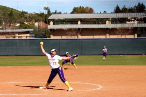 First-year pitcher Sammy Edmonds throws a heater of a fastball down the middle of home plate at Hutton Field. The Regals lost to the Claremont-Mudd-Scripps Athenas 9-6 in the first game of their double header and 10-0 in the second.  (Photo by Spencer Hardie)