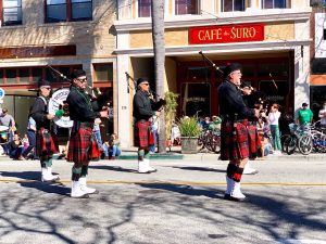 Luck of the Irish: A band of bagpipe players, clad in traditional Irish kilts and garb, pause as spectators look on.  Photo by James Alfaro - Reporter
