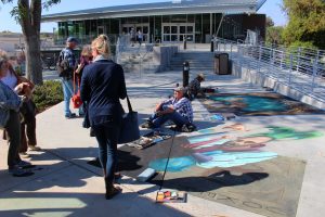 Attendees of the Representational Art Conference walk through the Chalk Festival on Cal Lutheran's campus on April 2. They also visited the Kwan Fong Gallery of Art and Culture and William Rolland Gallery of Fine Art on campus.  Photo by Spencer Hardie- Photojournalist. 